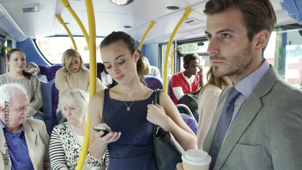 Passengers Standing On Busy Commuter Bus