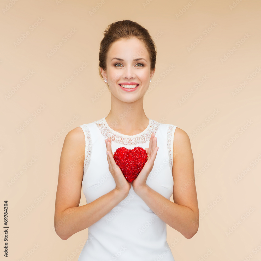 smiling woman in white dress with red heart smiling woman in white dress with red heart