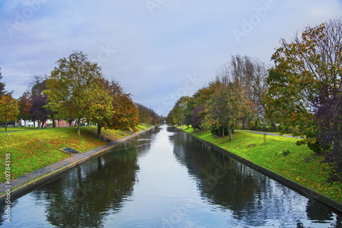 view of the park from the river in the coastal city photo