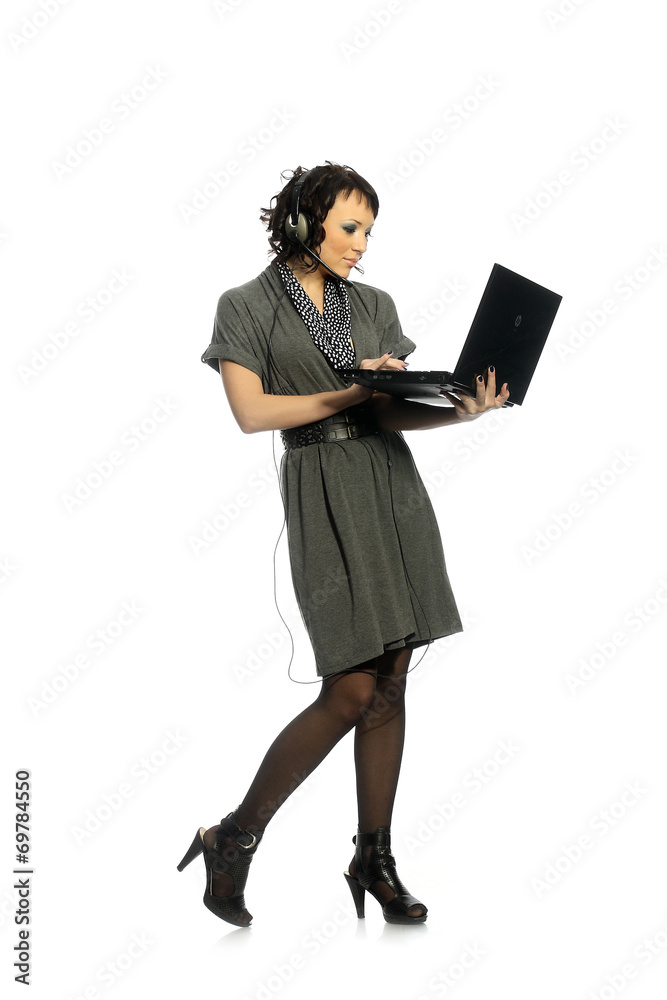 An attractive girl talking on the internet with headphones An attractive girl talking on the internet with headphones