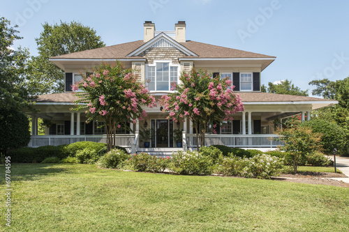 Beautiful southern home with white wrap around porch