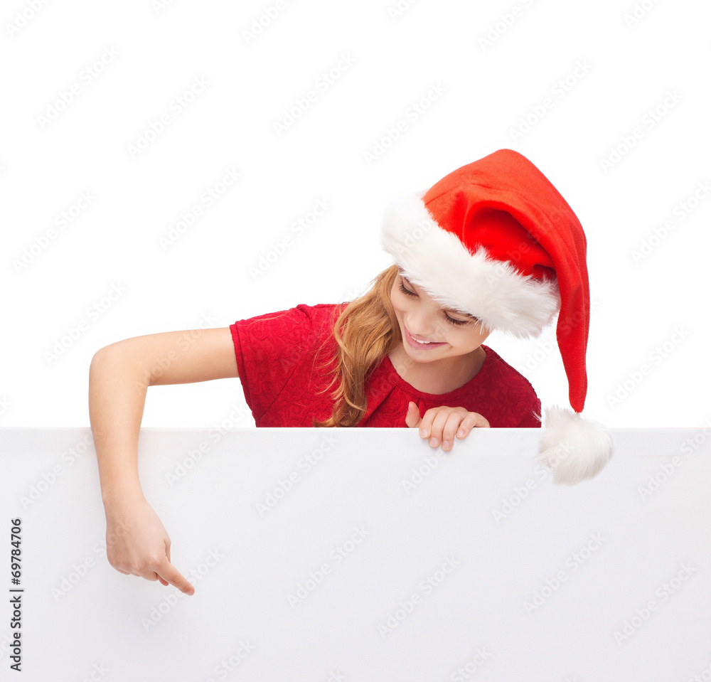 child in santa helper hat with blank white board child in santa helper hat with blank white board