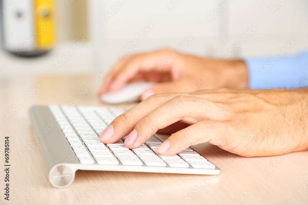 Man working with keyboard Man working with keyboard