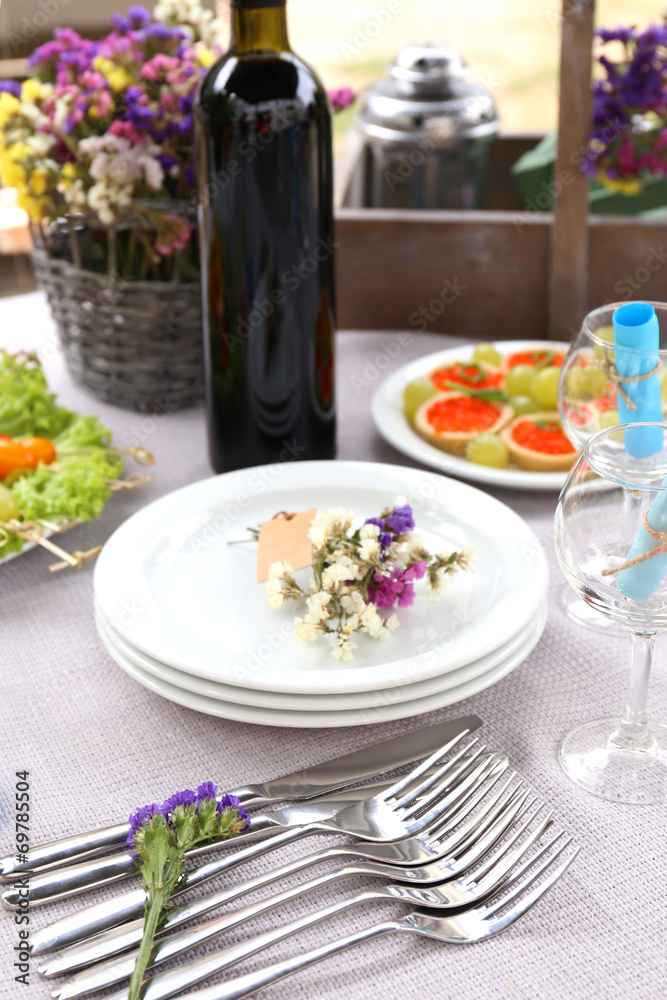 Buffet table with dishware waiting for guests Buffet table with dishware waiting for guests