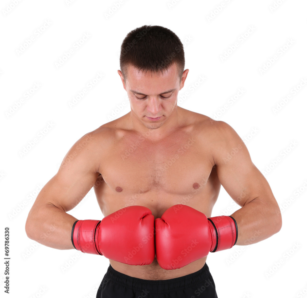 Handsome young muscular sportsman with boxing gloves isolated