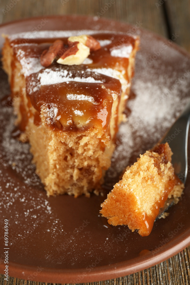 Half eaten delicious cake piece on plate on wooden table Half eaten delicious cake piece on plate on wooden table