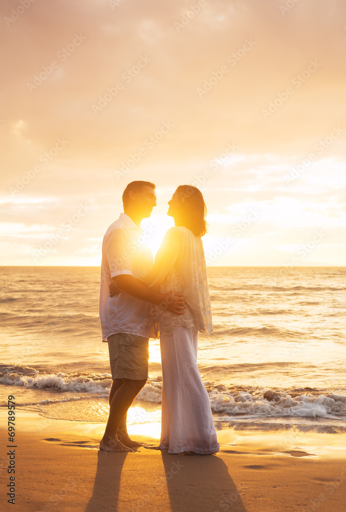 Mature Couple Kissing at Sunset