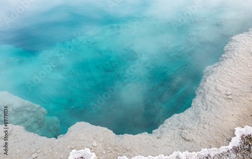 Deep aqua color hot spring in Yellowstone Park photo