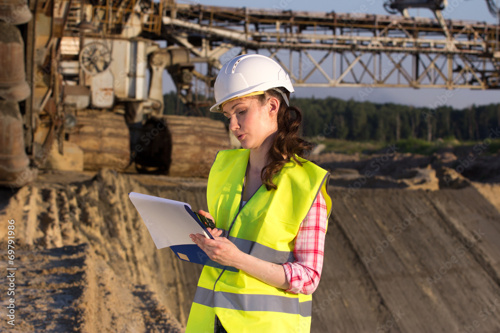Pretty woman working on construction site