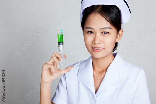 Young Asian nurse hold syringe