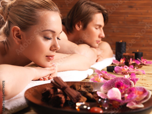 Attractive couple relax at the spa salon.