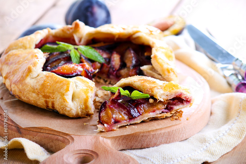 Plum tart on table