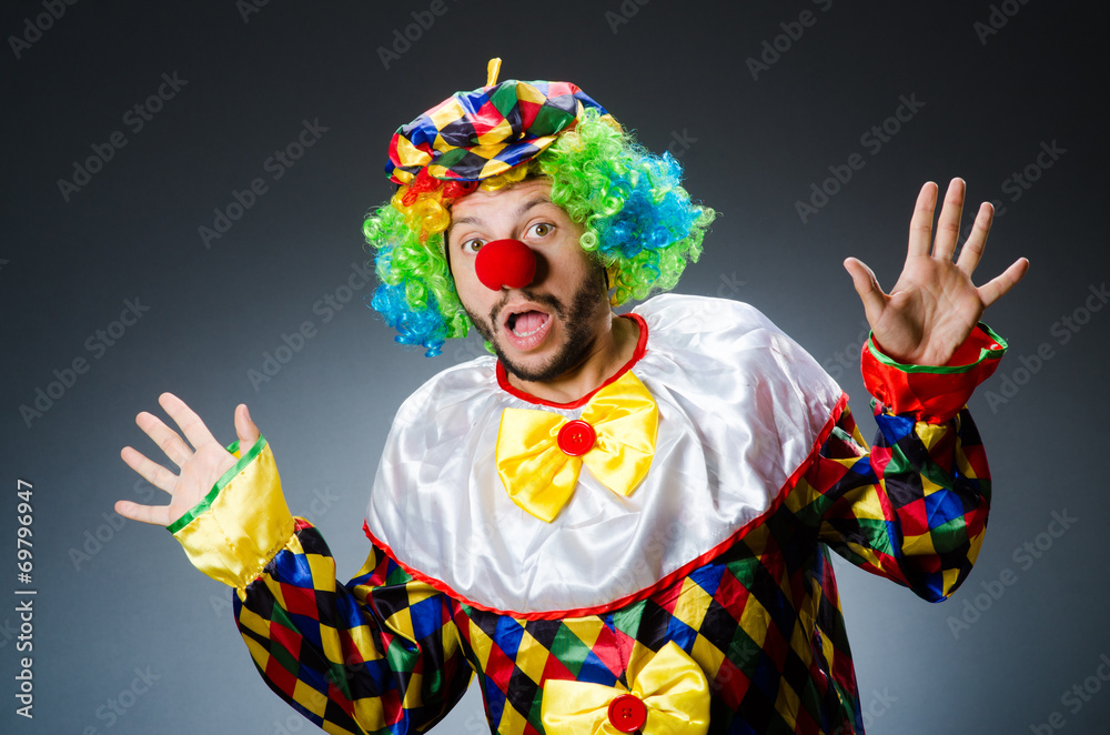 Funny clown in colourful costume