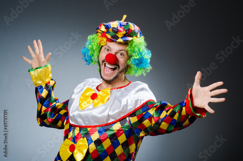 Funny clown in colourful costume