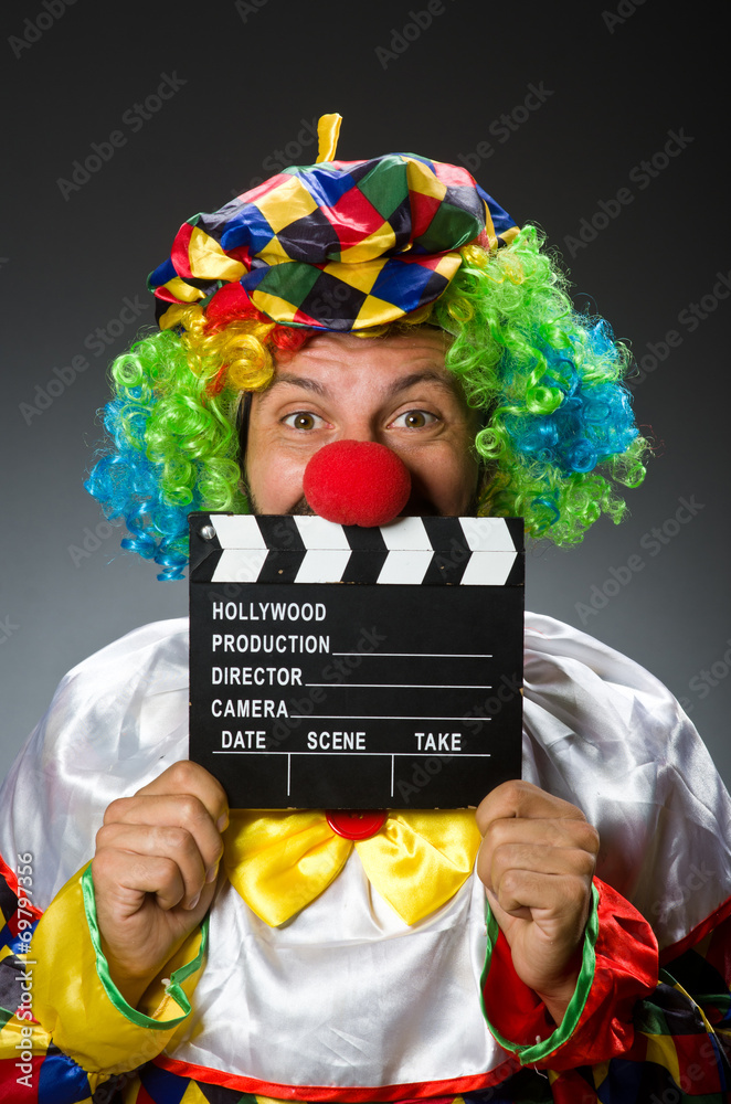 Clown with movie clapper board Clown with movie clapper board