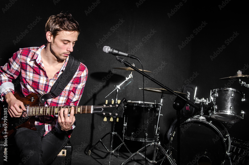 Fototapeta premium Man with guitar during concert