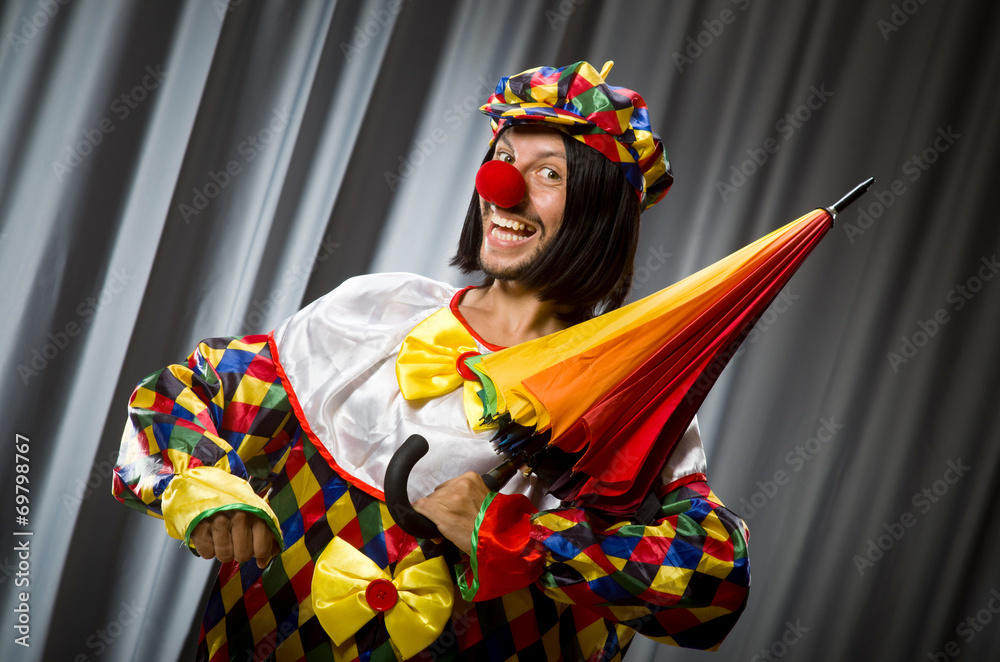 Funny clown with colourful umbrella Funny clown with colourful umbrella