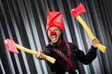 Funny clown with red axe
