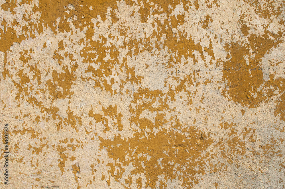 Old grunge weathered scratched plastered wall as background