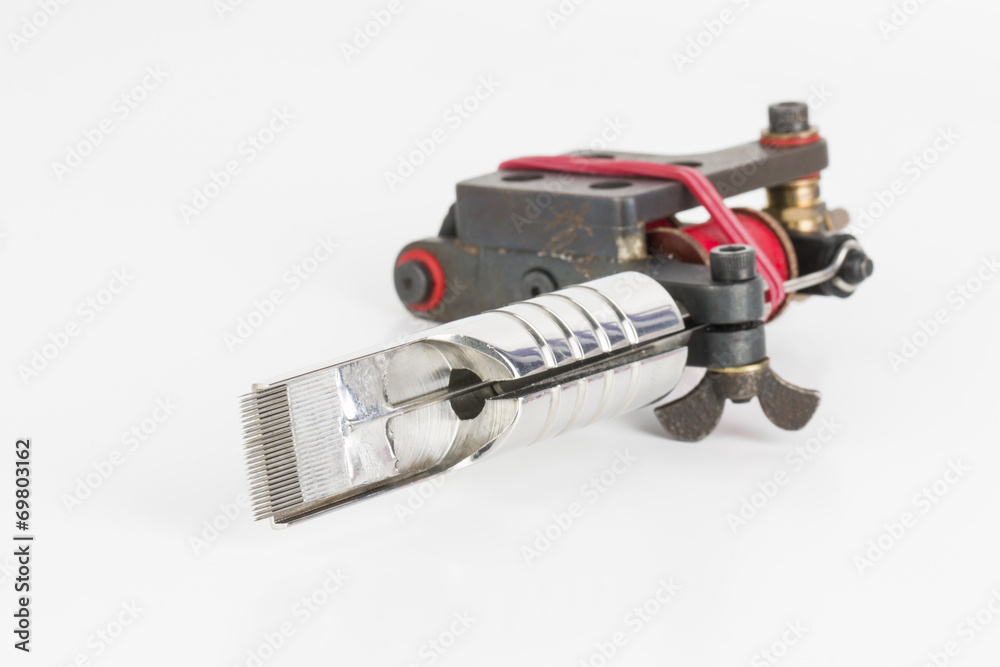 Tattoo machine ( gun ) and needle - Stock Image macro. Tattoo machine ( gun ) and needle - Stock Image macro.