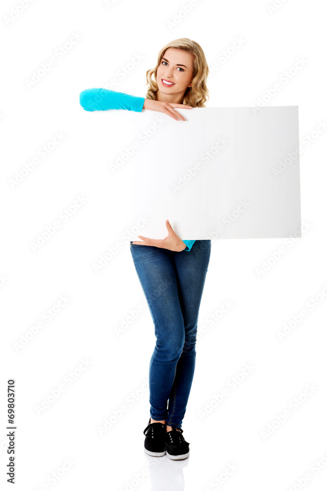 Portrait of happy woman with blank board Portrait of happy woman with blank board