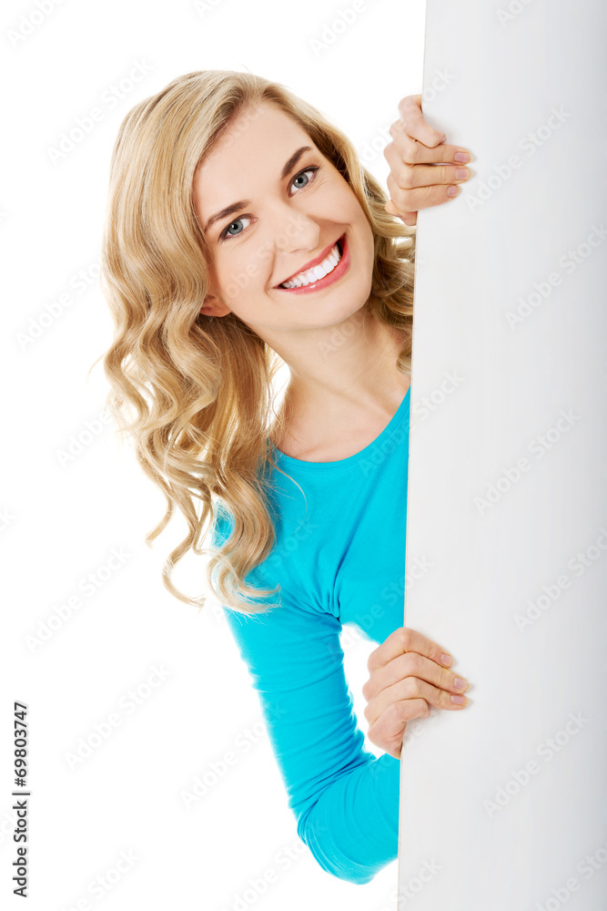 Portrait of happy woman with blank board Portrait of happy woman with blank board