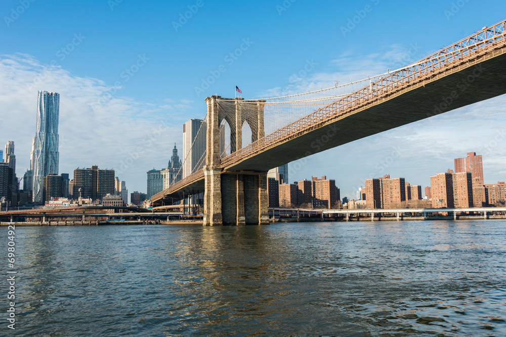 Brooklyn bridge in New York on bright summer day