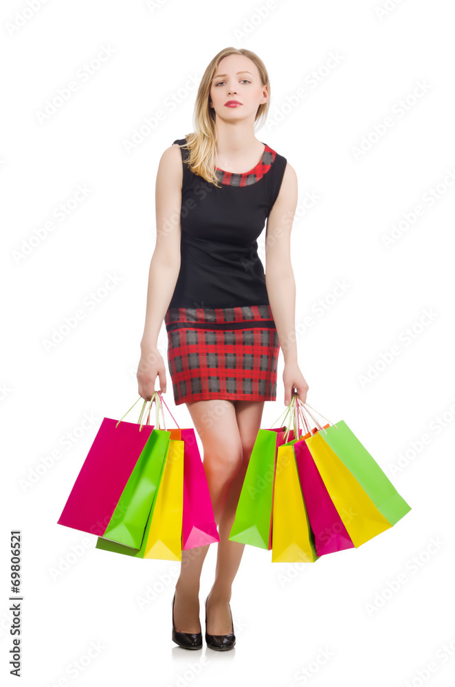 Woman after shopping spree on white