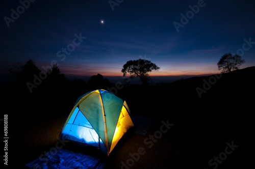 Illuminated Yellow Camping tent at Night