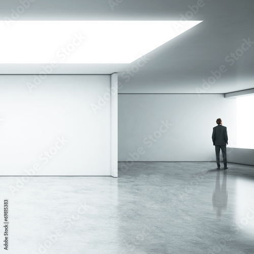 Businessman standing in white office
