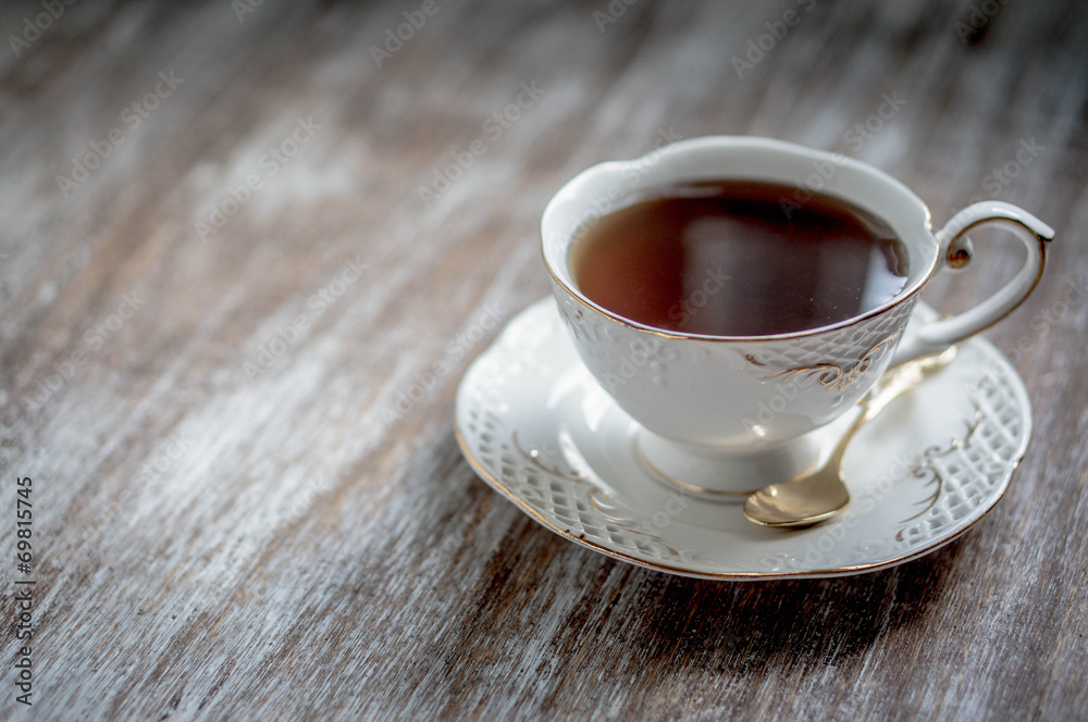 Obraz premium Cup of tea on wooden background