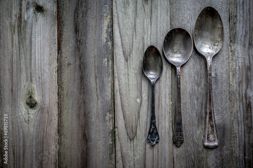 Rustic silverware set on wooden background