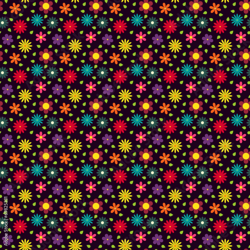 Seamless pattern with different colorful flowers and green leave