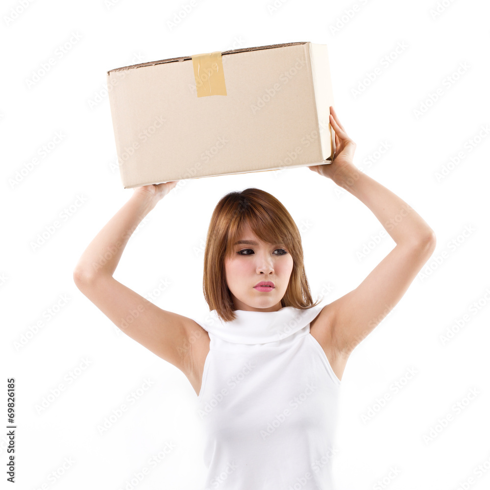 unhappy, bored woman carrying heavy box with boredom unhappy, bored woman carrying heavy box with boredom