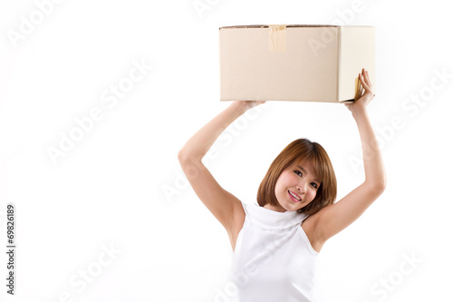happy, smiling woman carrying carton box for moving concept
