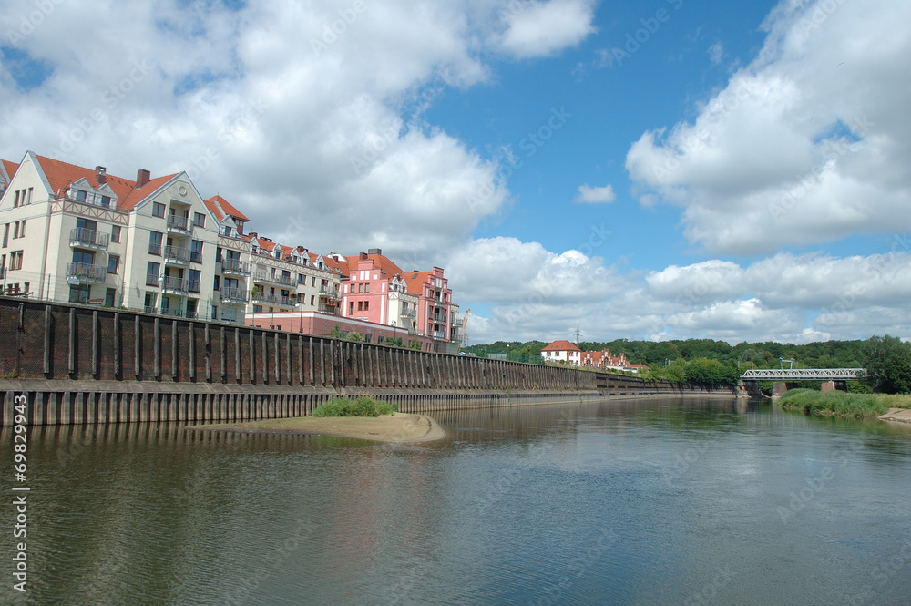 Fototapeta premium Buildings at Warta river in Poznan, Poland