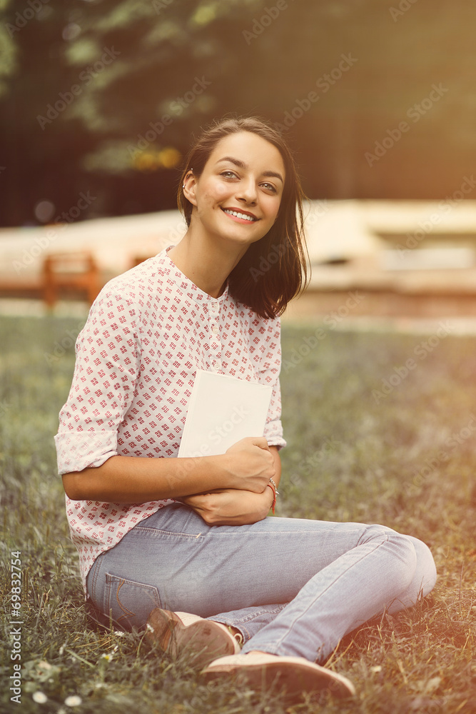 Beautiful girl holding an open book Beautiful girl holding an open book
