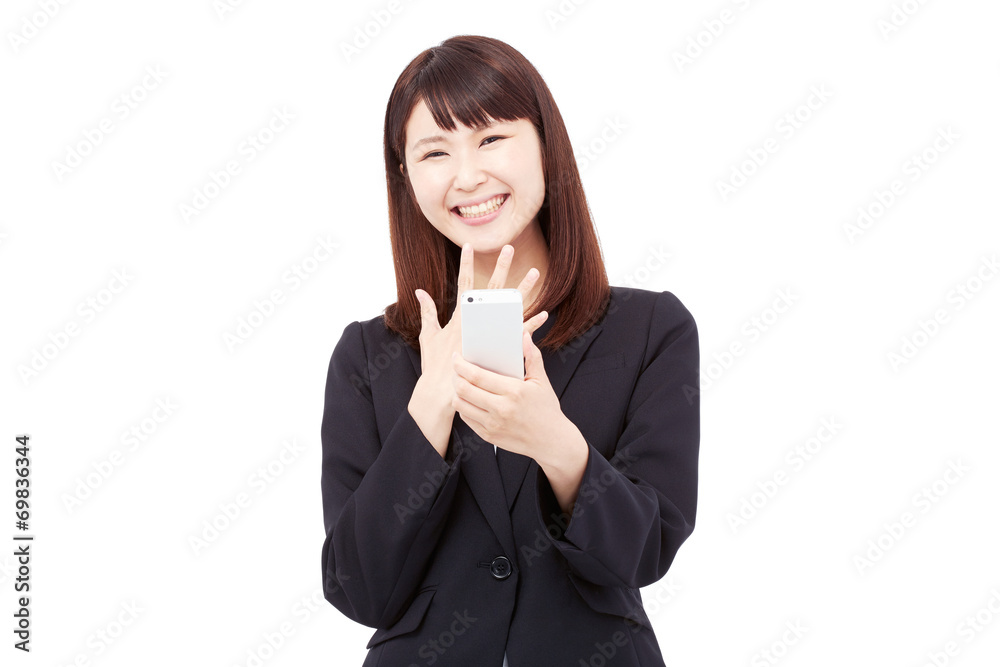 スマートフォンを持って笑うビジネスウーマン スマートフォンを持って笑うビジネスウーマン