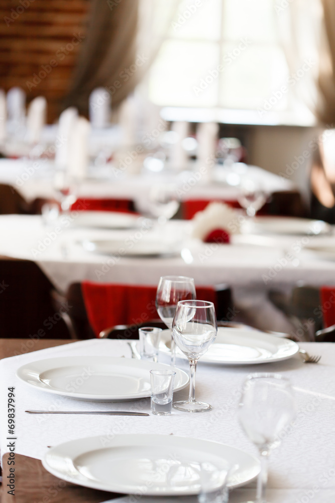 Tables set for meal Tables set for meal