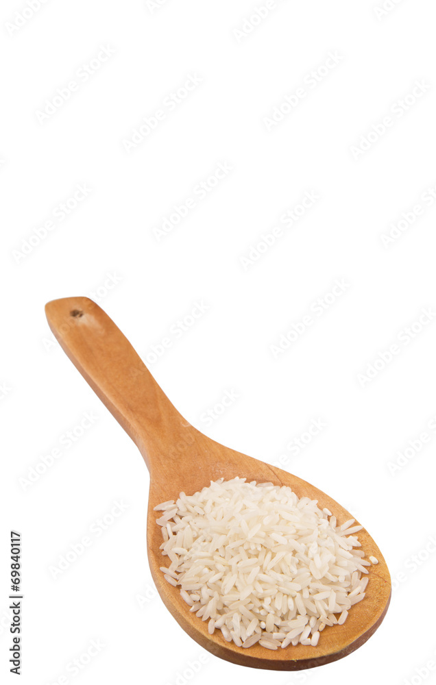 Raw and uncooked rice in wooden spoon over white background Raw and uncooked rice in wooden spoon over white background