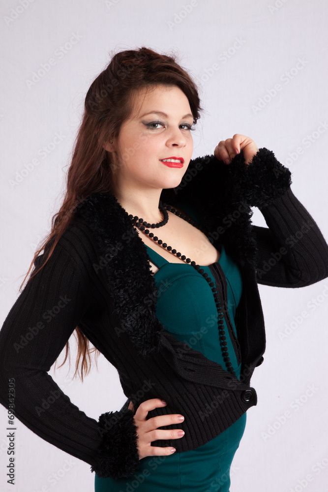 Fototapeta premium Woman in green dress and black jacket