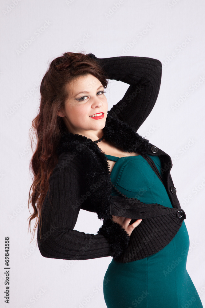 woman in green dress smiling at the camera woman in green dress smiling at the camera