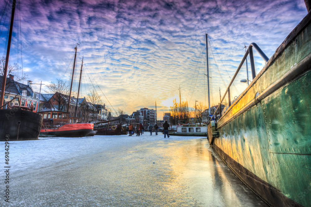 Winter landscape of a  canal in a city
