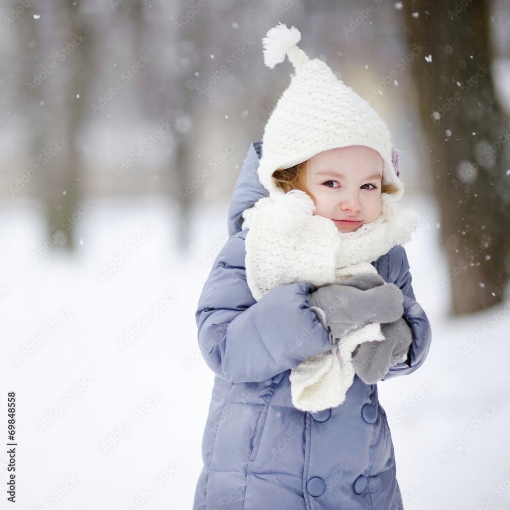 Little girl having fun at winter