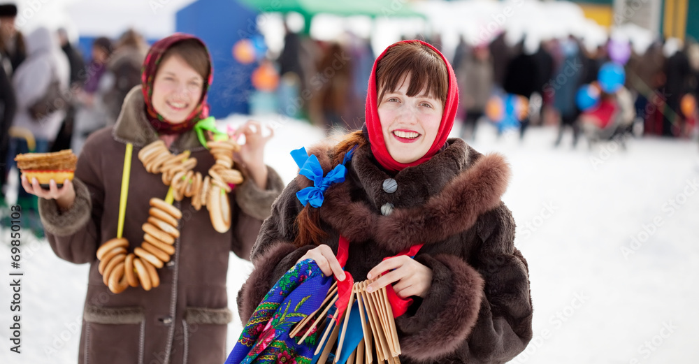 girls celebrating  Pancake Week at Russia