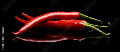 Red chilli peppers isolated on black background #69851386