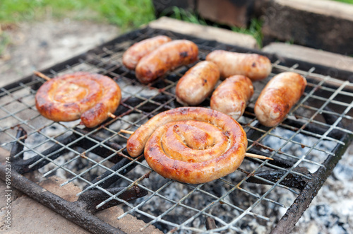 Delicious german sausages on the barbecue grill