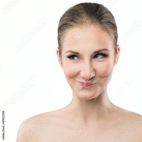 Vászonkép portrait of a young woman making funny face expression