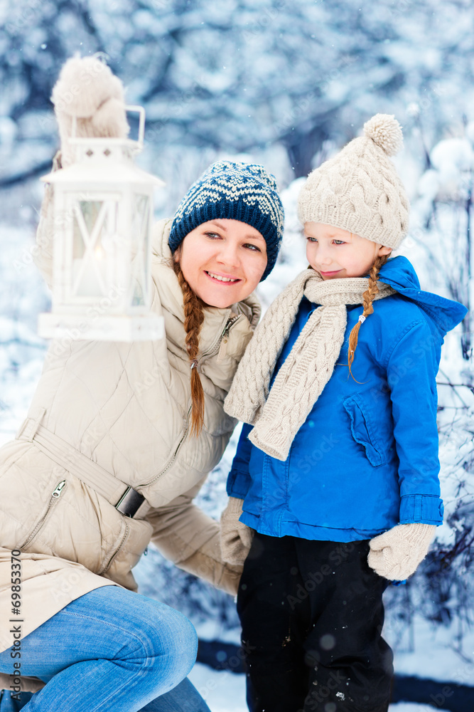 Mother and daughter with Christmas lantern