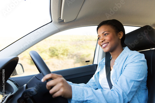 young african woman driving a car © michaeljung